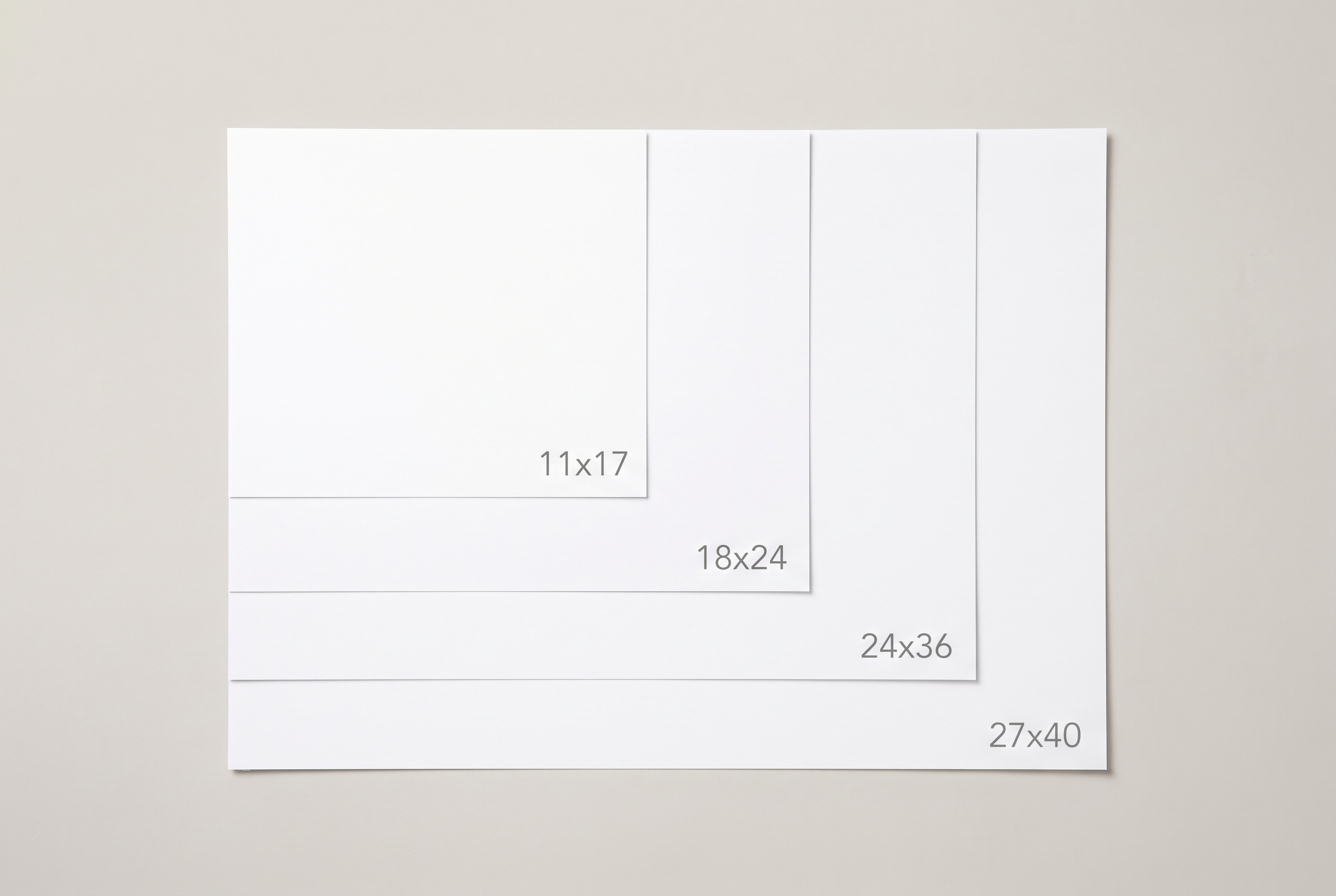 Common poster sizes shown side by side, from 11x17 up to 27x40
