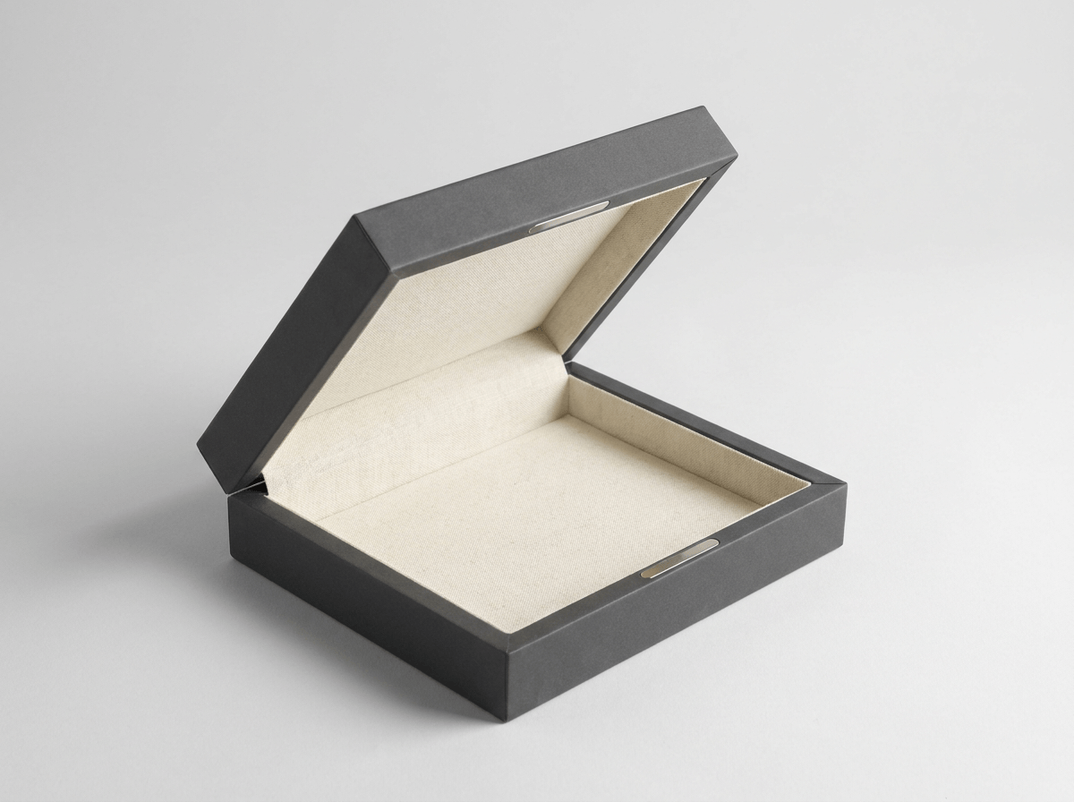 Rigid box with a magnetic flip lid open at an angle showing a lined interior