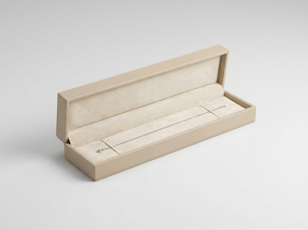 A slim jewelry box for a bracelet, open with insert
